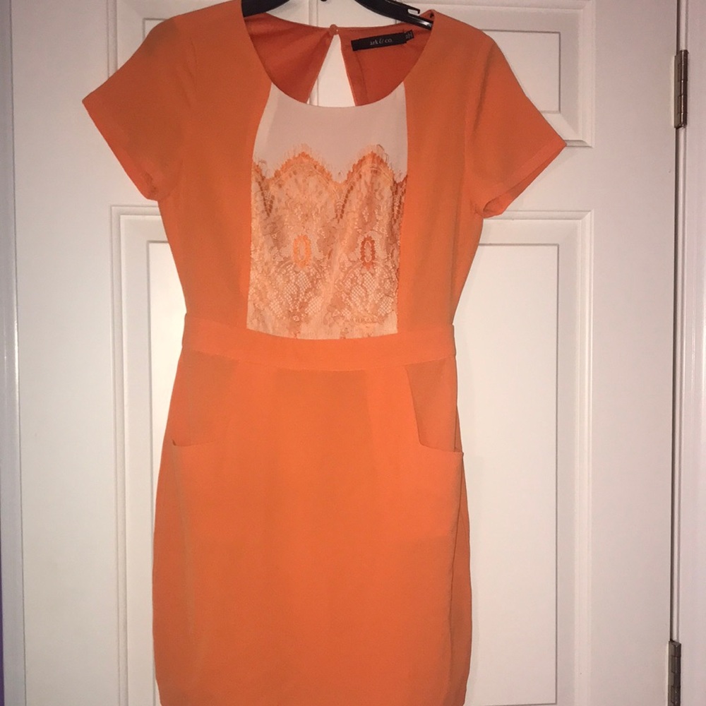 Bright orange short sleeved dress.